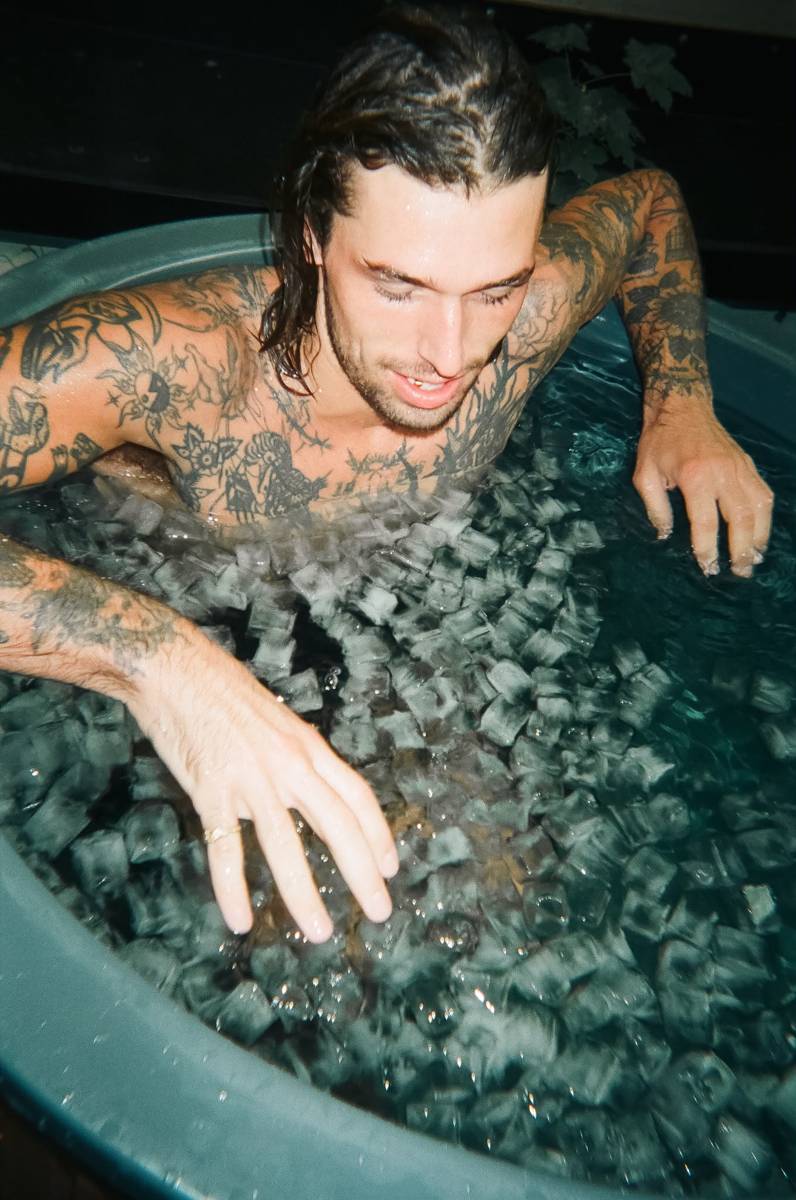 Guest in an ice bath in the Copenhagen hotel courtyard